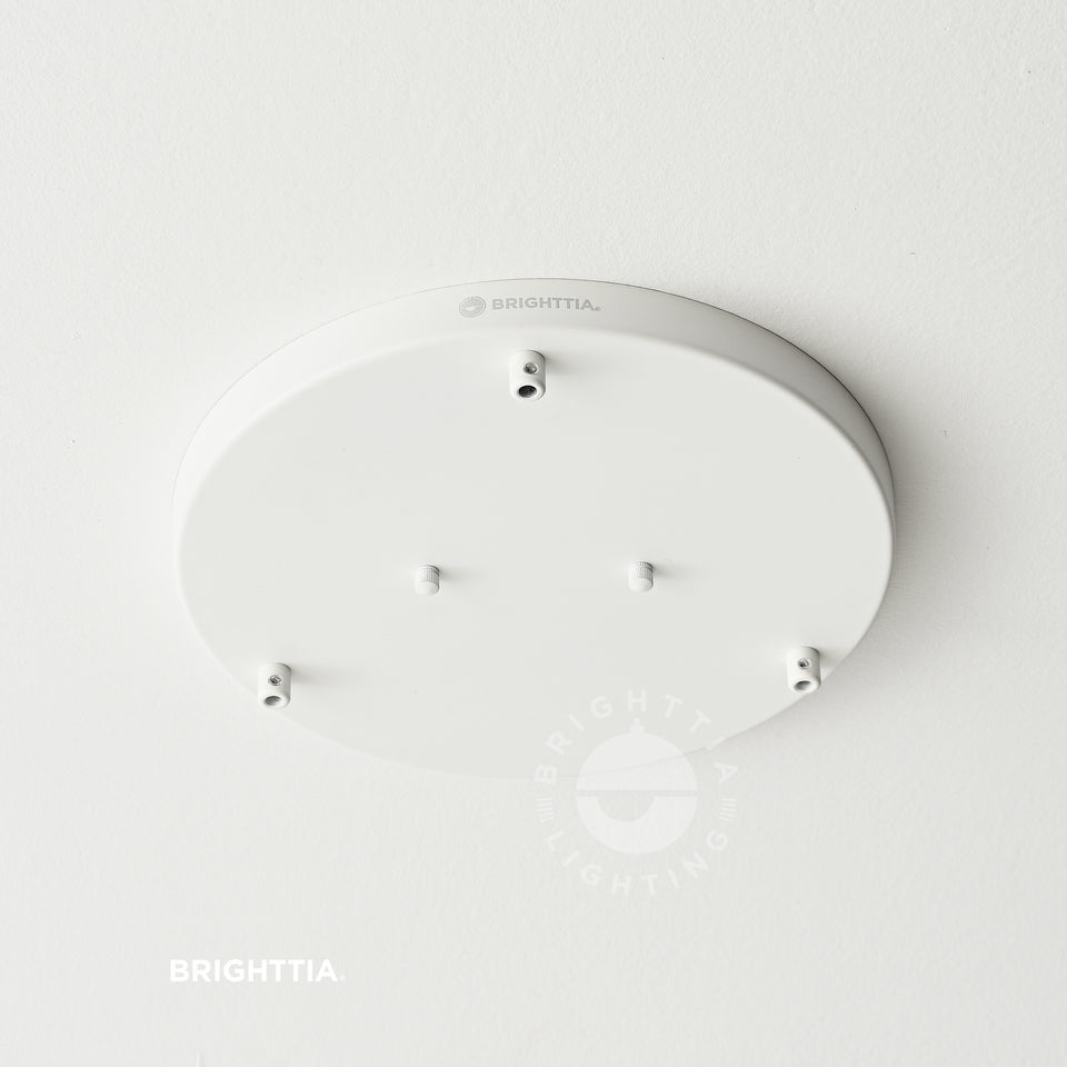 12in white 3-port ceiling canopy with white cord grips mounted on white ceiling.